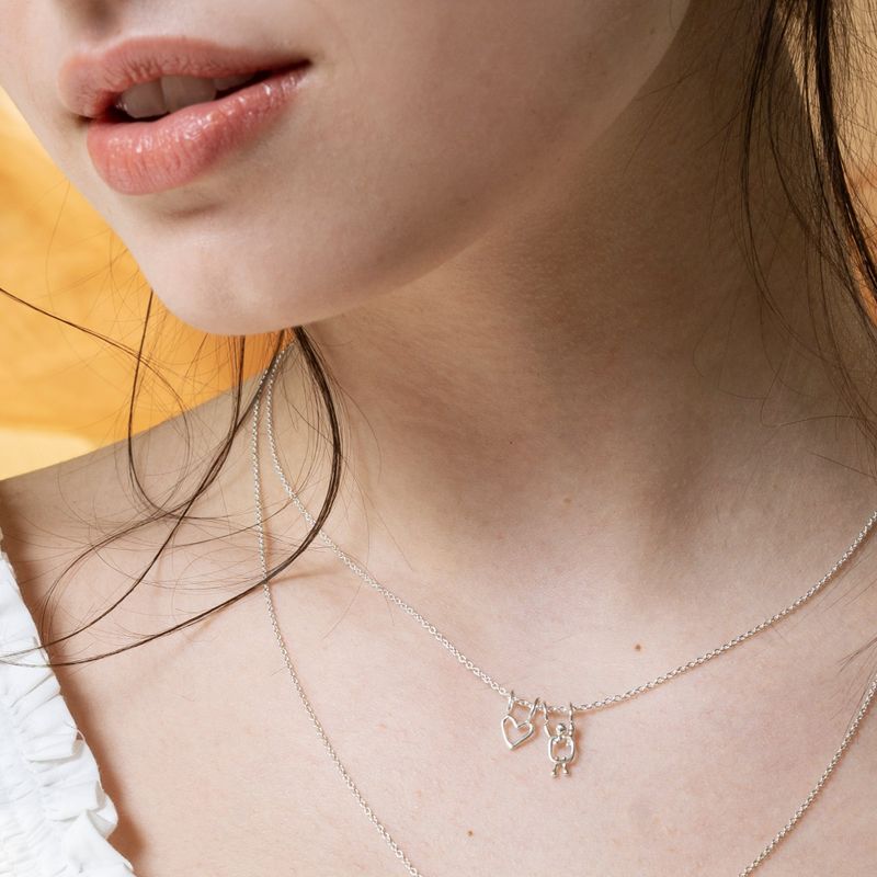 collier en argent coeur et garçon