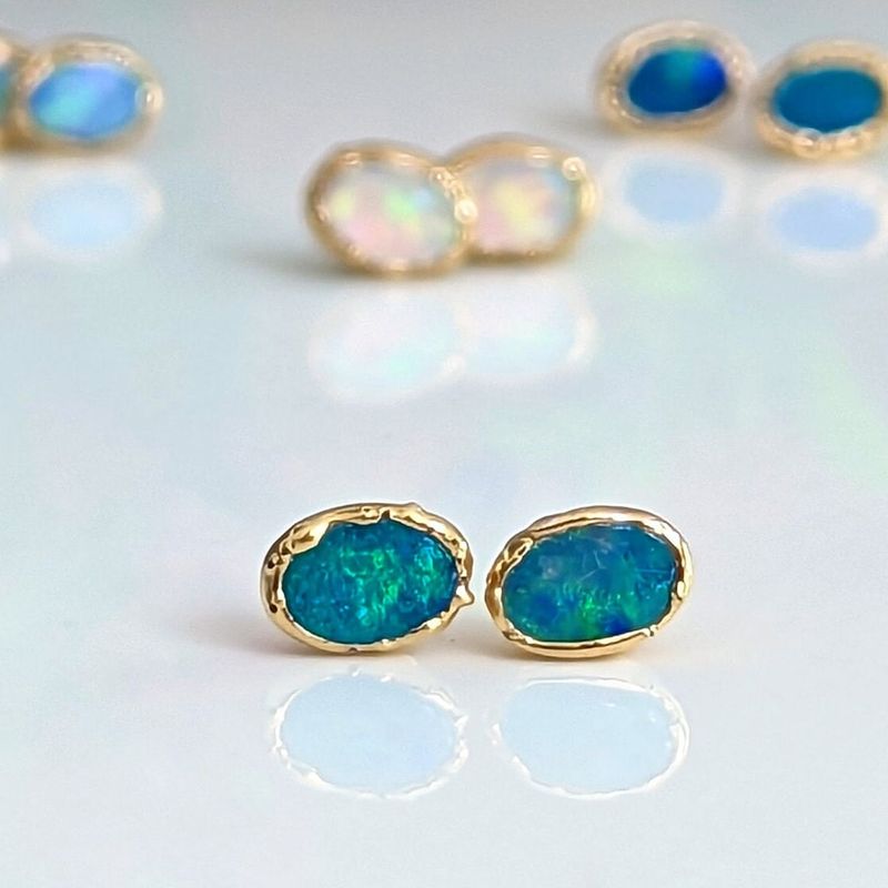 Blue Australian Opal stud earrings in 18k Gold