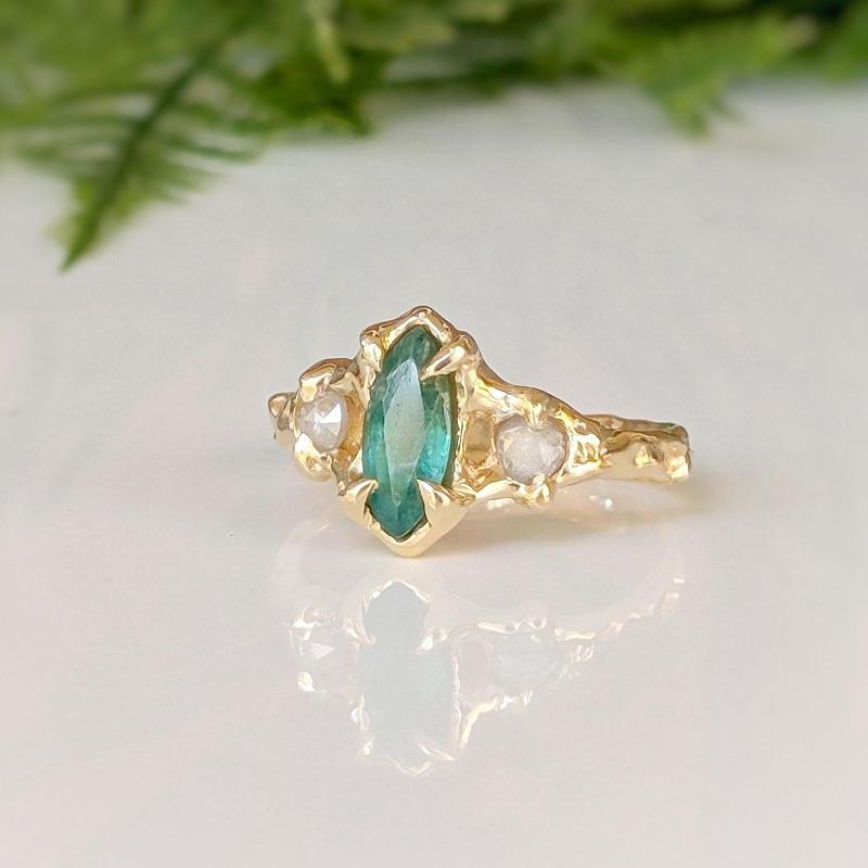 Emerald and diamond engagement ring
