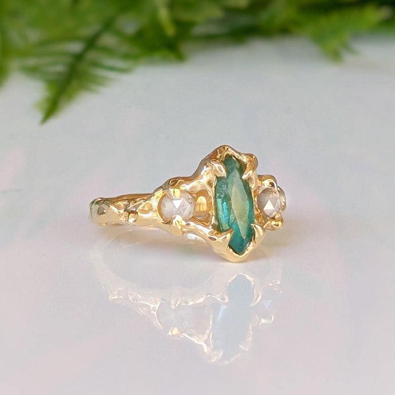 Emerald and diamond engagement ring