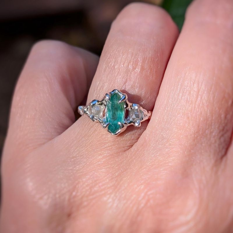 Silver Emerald and diamond engagement ring