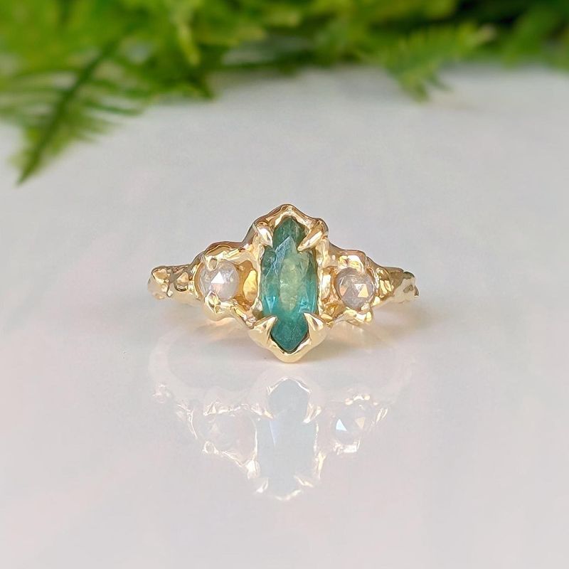 Emerald and diamond engagement ring