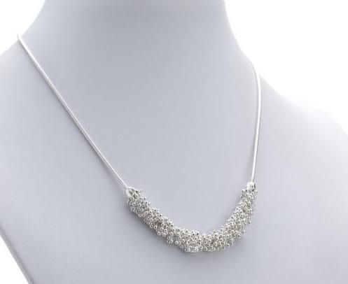 Collier avec quatre pouces de Shikshok classique en argent