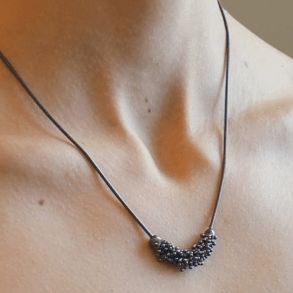Collier avec un pouce de Shikshok classique en argent